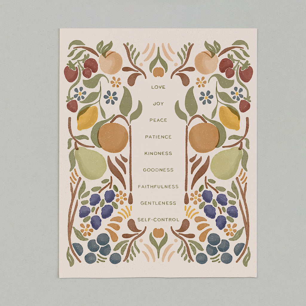 art print with fruit illustrations that surround the words that describe the fruit of the Spirit