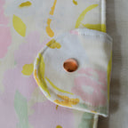 Floral-patterned fabric with a button on a light background