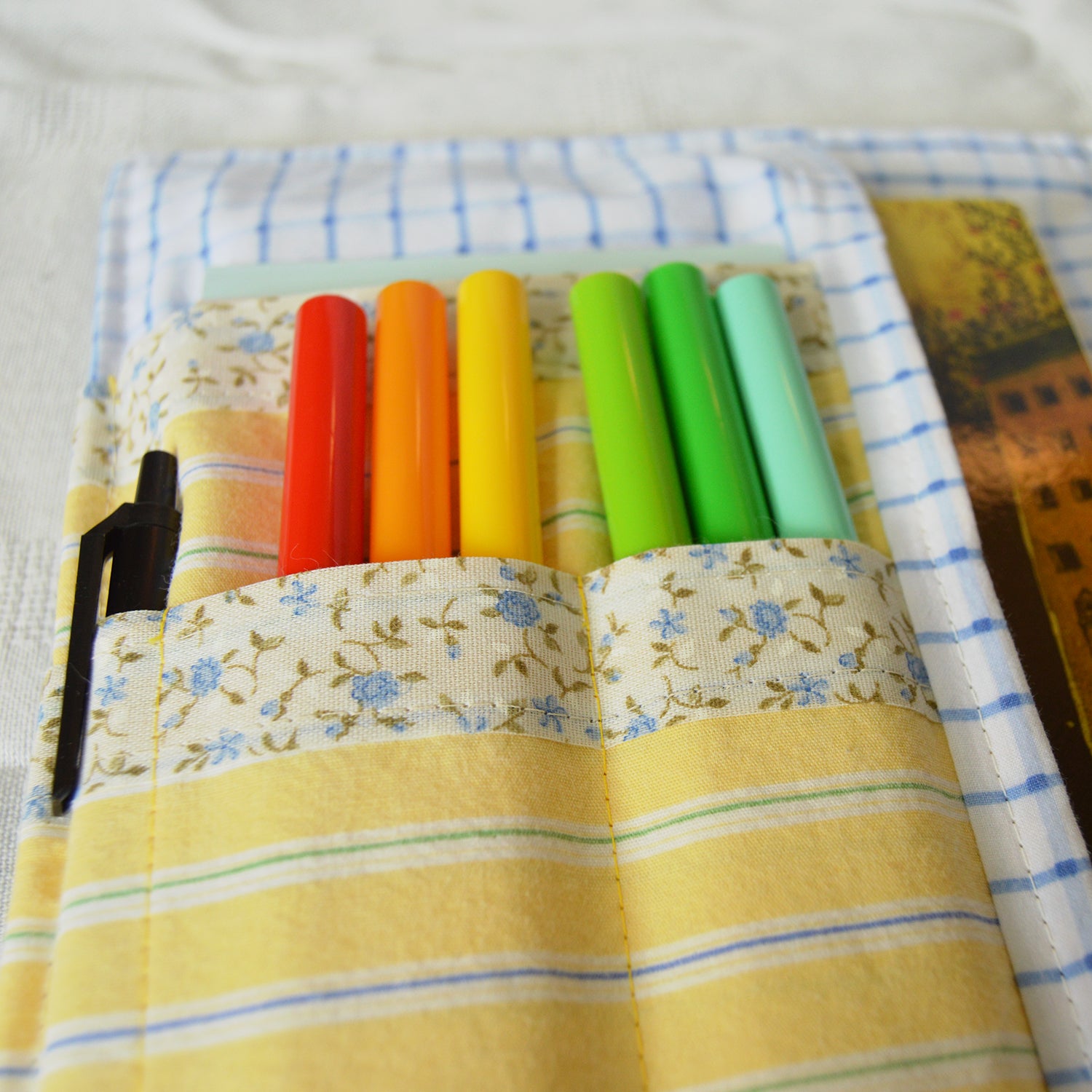 Set of colorful markers in slots a fabric case