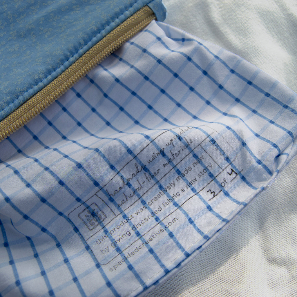 Close-up of a product with blue grid pattern and text on a white background