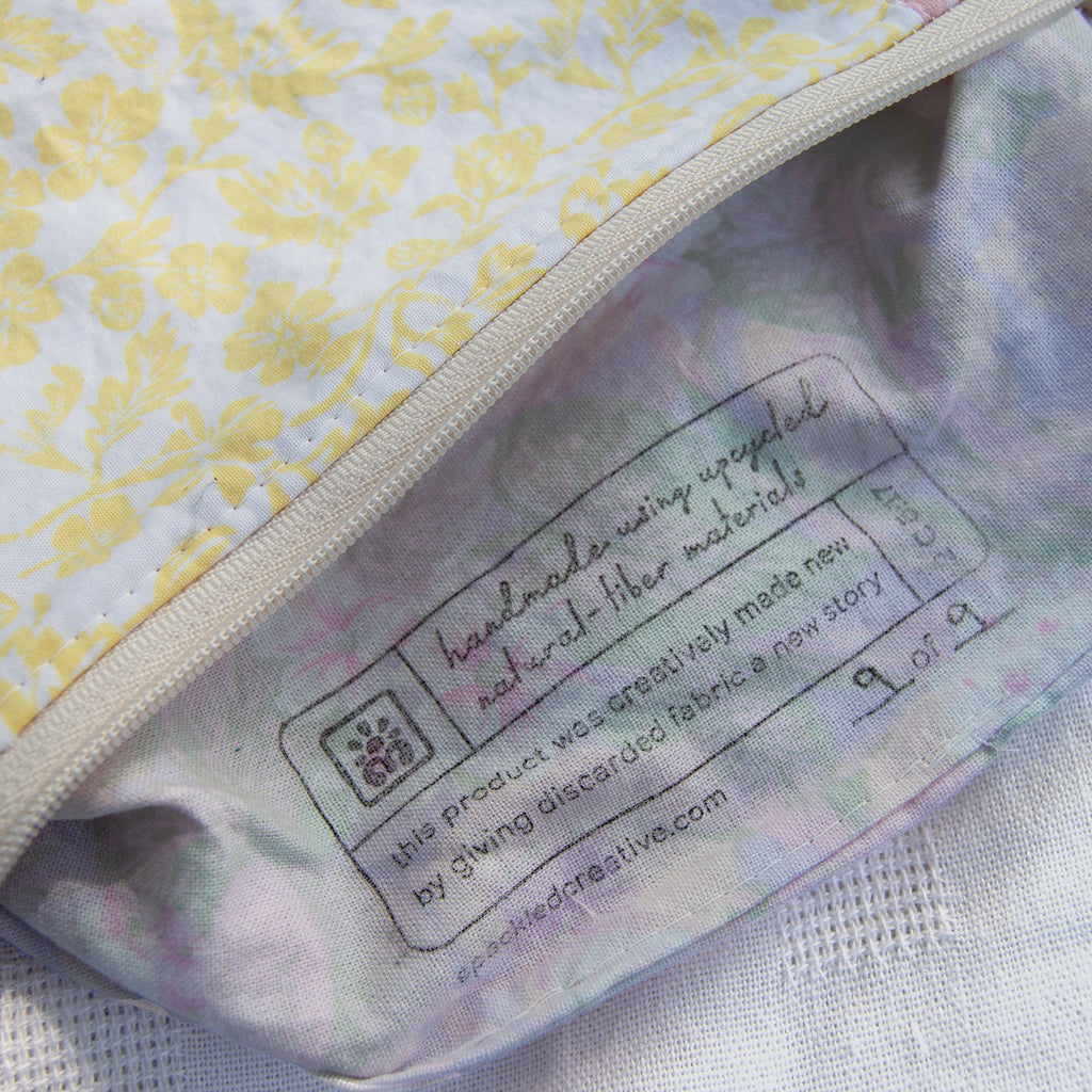 Close-up of a label on a product with floral patterns in the background