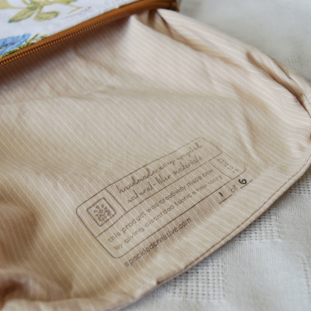 Close-up of a beige fabric with a label on a textured surface