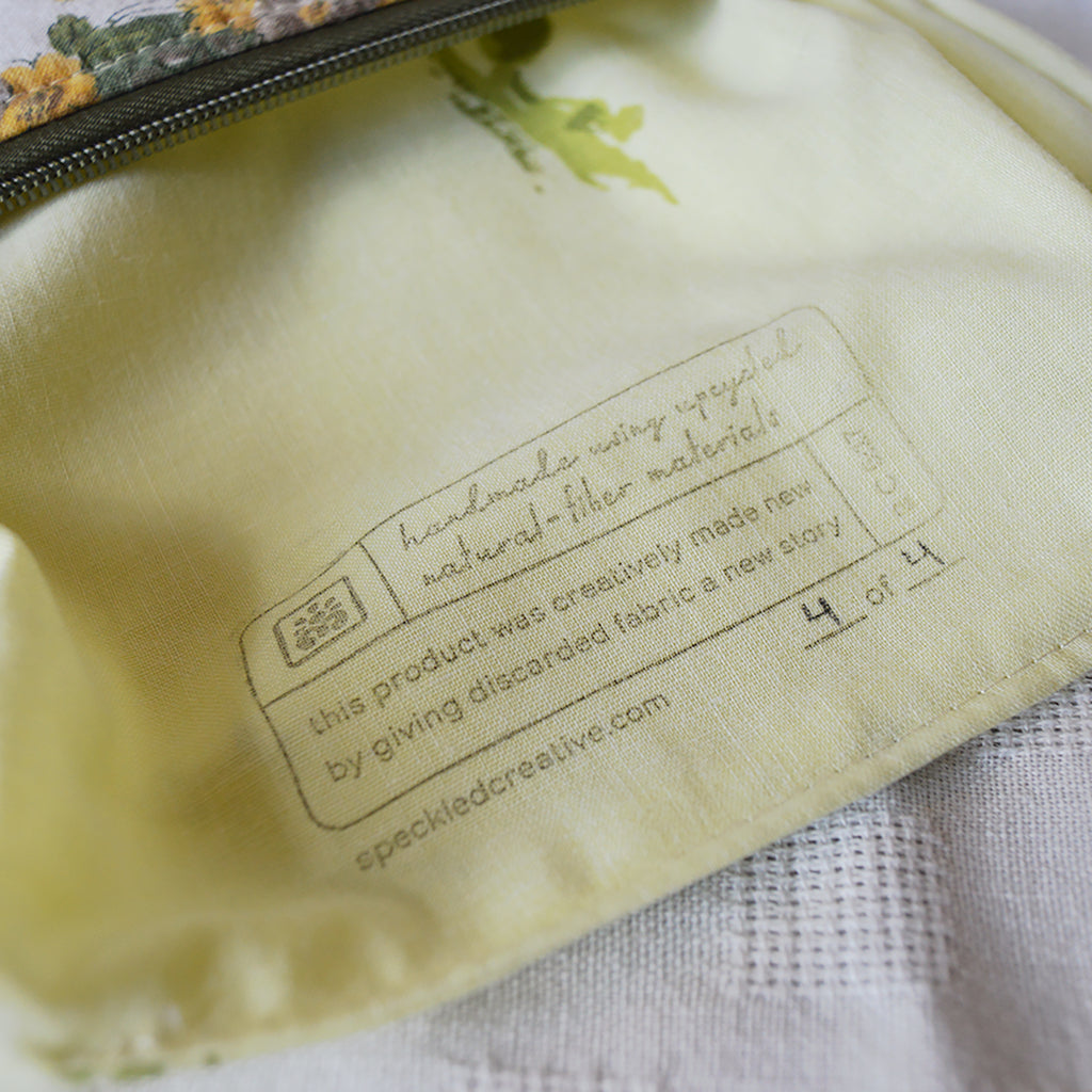 Fabric pouch with a label on a textured surface